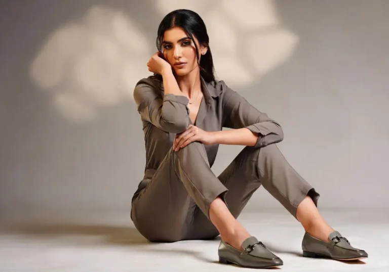 Fashion editorial image of a woman styling loafers with minimal outfit, representing versatile women’s footwear for everyday comfort